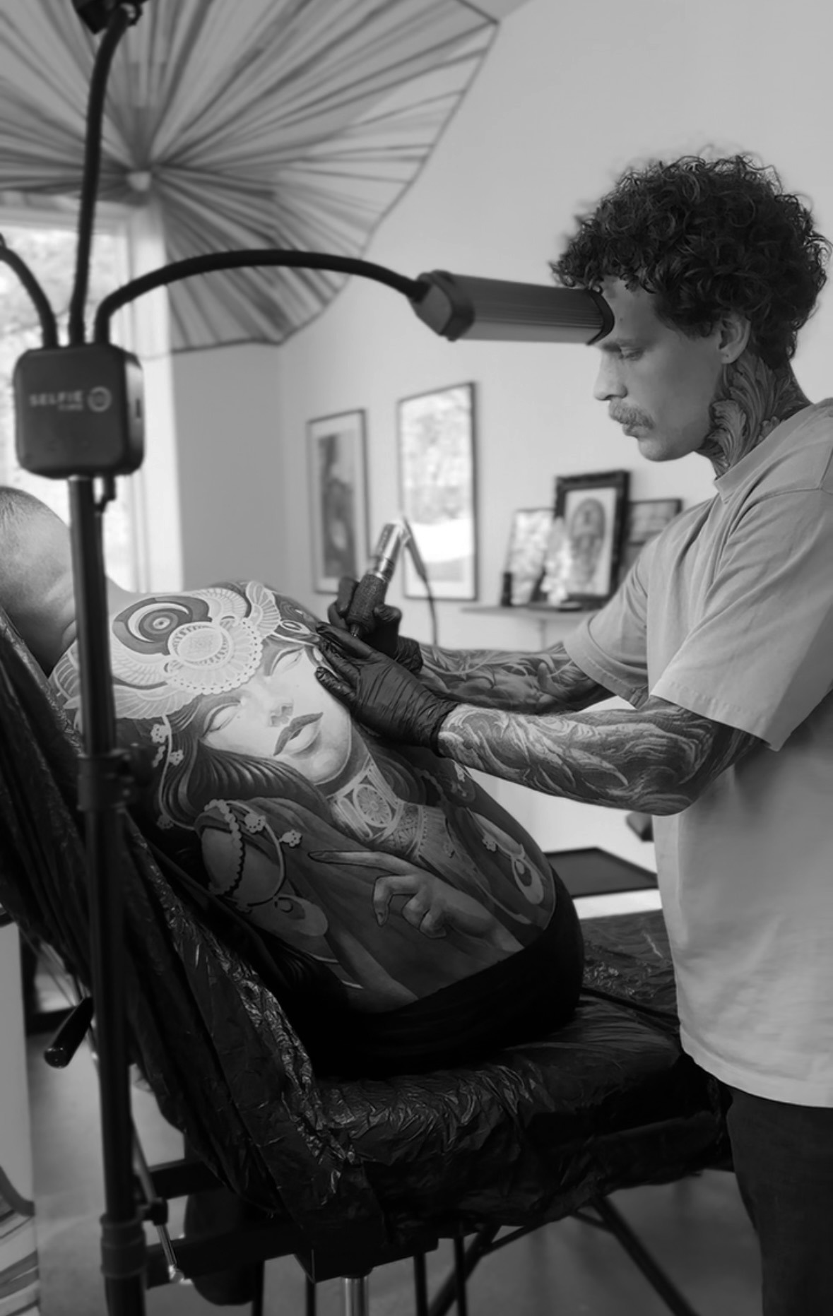 Mr Calle tattooing a back piece